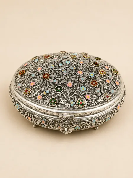 Round sterling silver dry fruit box with an all-over jewelled flower garden lid, handcrafted in Jaipur.
