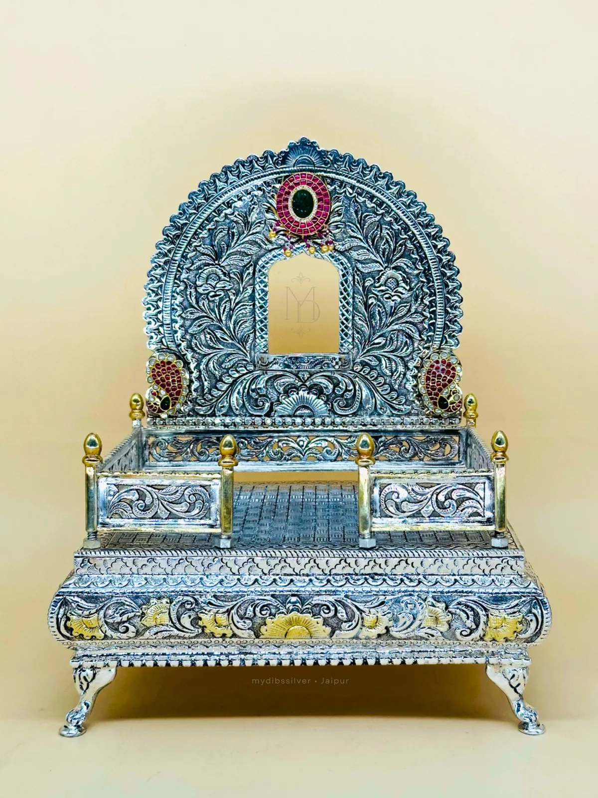 Sterling silver singhasana with a moon-arched back of deep silver nakshi engraving, handcrafted in Jaipur.