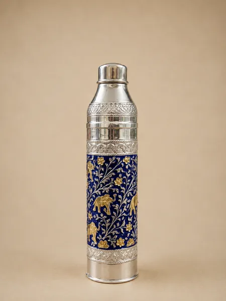 Sterling silver water bottle with gold elephants on a royal blue enamel ground, handcrafted in Jaipur.