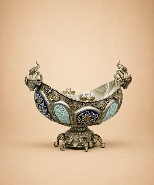 Sterling silver boat-shaped fruit bowl carried by elephants with blue meenakari panels, handcrafted in Jaipur.