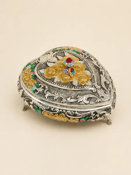 Heart-shaped sterling silver dry fruit box crowned with a bouquet of gold roses, handcrafted in Jaipur.
