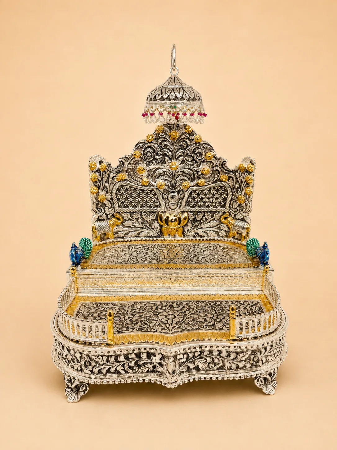 Sterling silver deity throne with a gold lotus, guardian elephants, and green-and-red meenakari enamel, handcrafted in Jaipur.