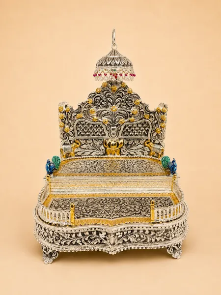 Sterling silver deity throne with a gold lotus, guardian elephants, and green-and-red meenakari enamel, handcrafted in Jaipur.