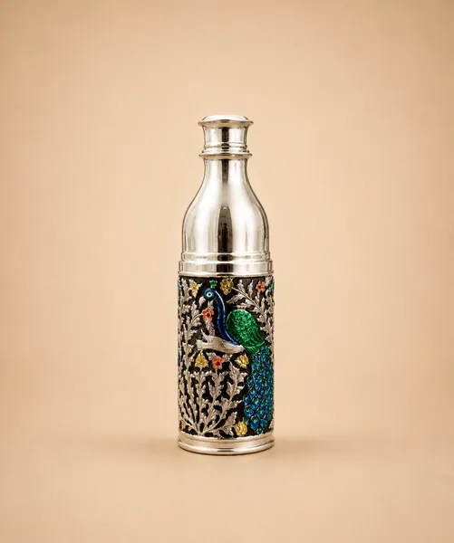 Sterling silver water bottle with a peacock in green-and-blue meenakari on a dark ground, handcrafted in Jaipur.