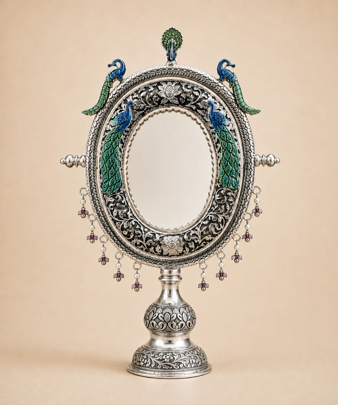 Sterling silver standing mirror framed by fish in meenakari with pearl-and-stone drops, handcrafted in Jaipur.