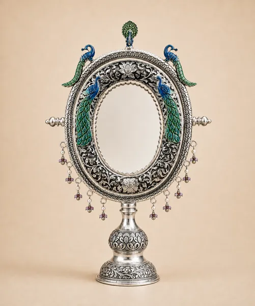 Sterling silver standing mirror framed by fish in meenakari with pearl-and-stone drops, handcrafted in Jaipur.
