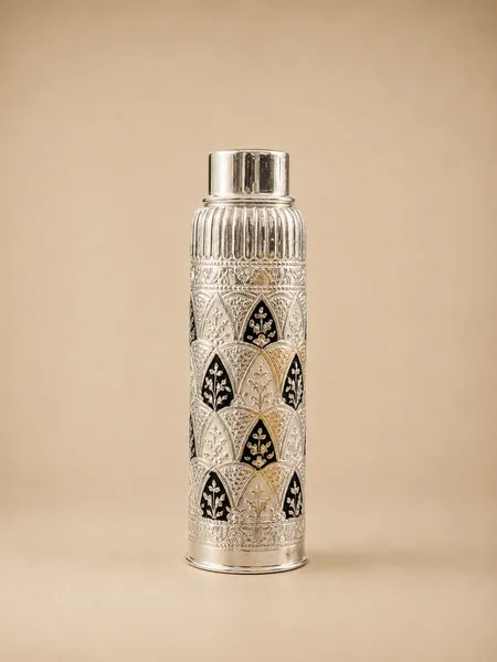 Sterling silver water bottle in an all-over silver scale lattice with dark enamel, handcrafted in Jaipur.