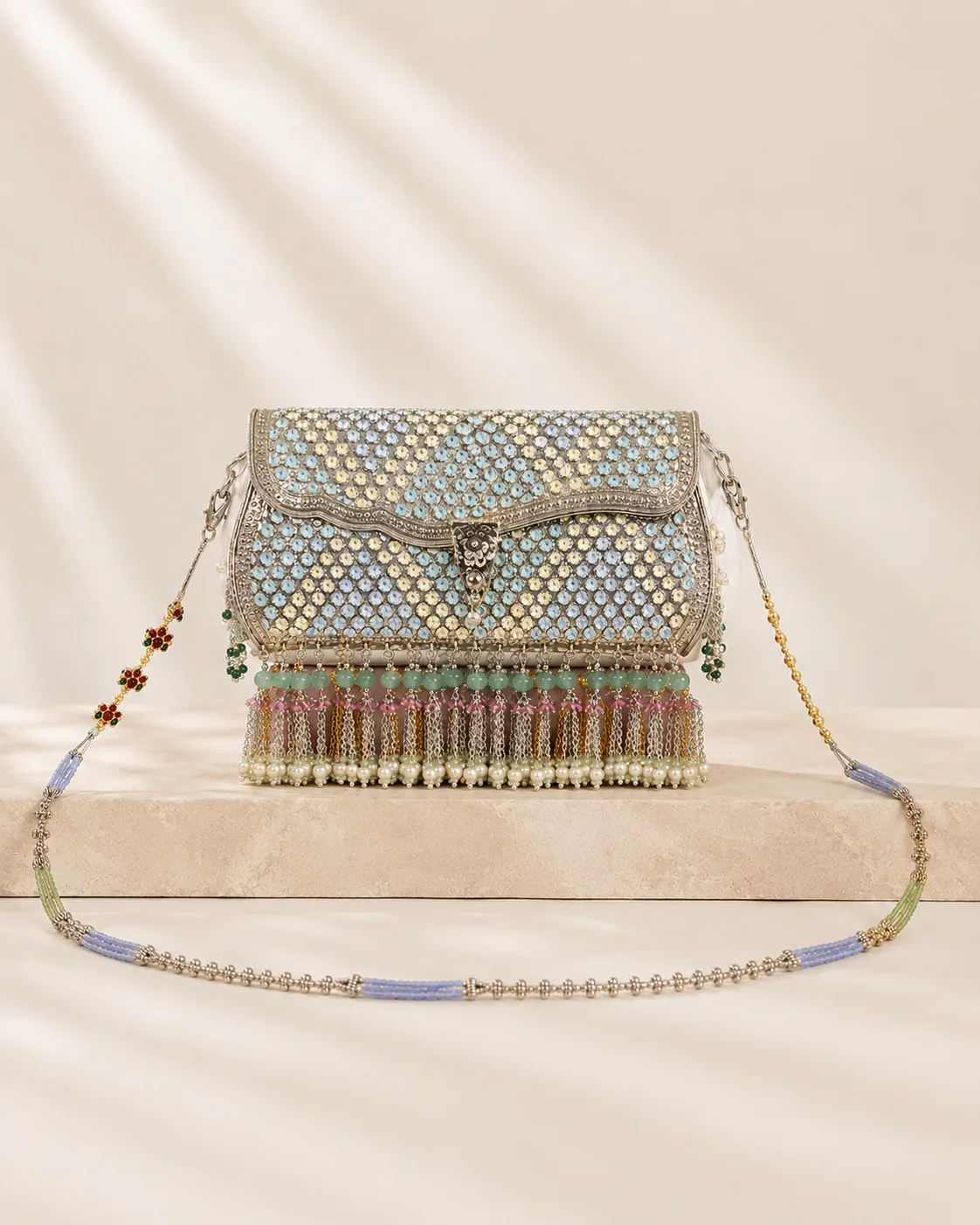 Sterling silver clutch in aqua filigree with a stone chain, handcrafted in Jaipur.
