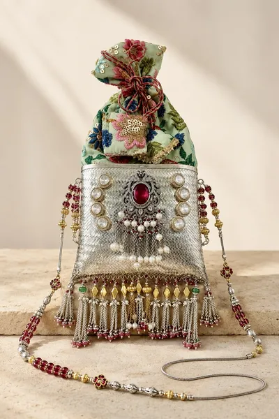 Sterling silver potli purse with floral silk and beaded strands, handcrafted in Jaipur.
