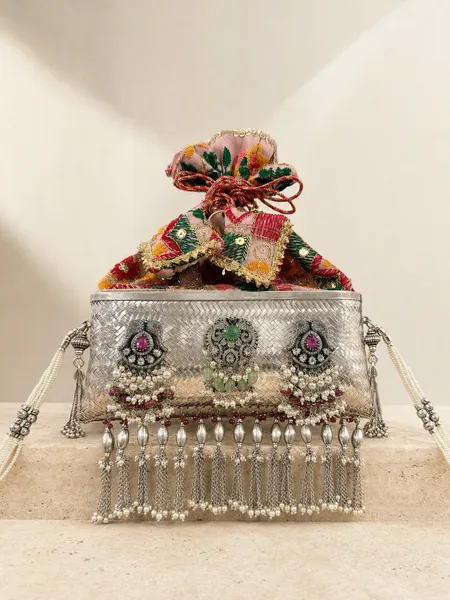 Sterling silver purse with jewelled florals and pearl drops, handcrafted in Jaipur.