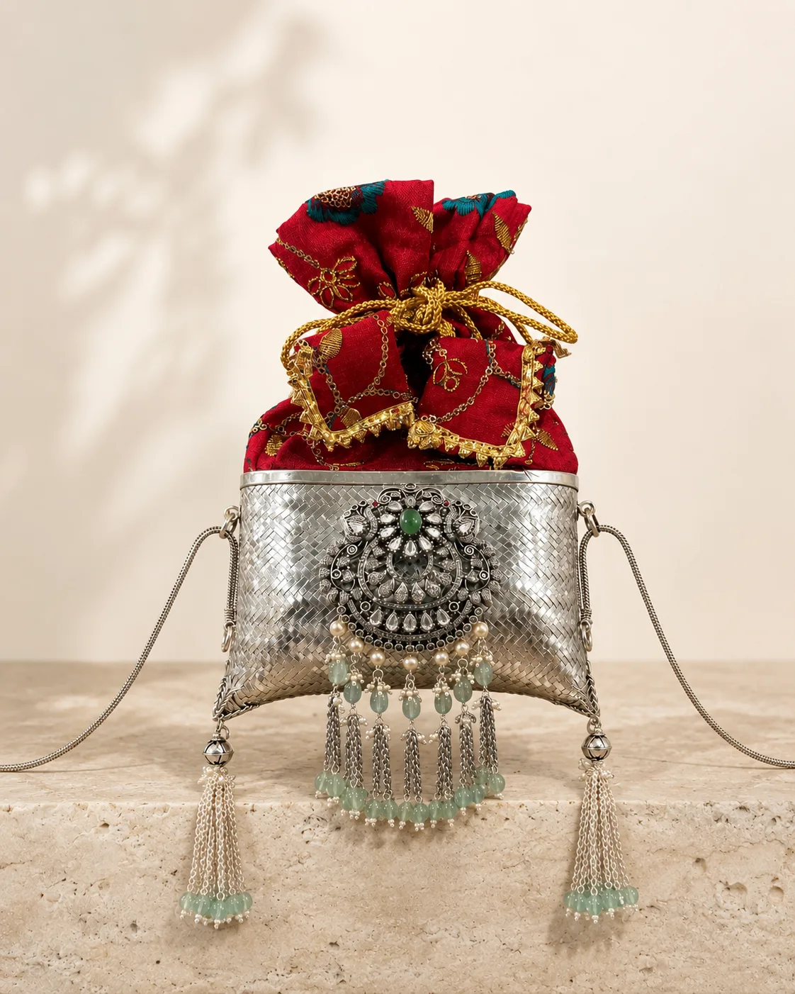 Sterling silver potli purse with scarlet silk and enamel tassels, handcrafted in Jaipur.