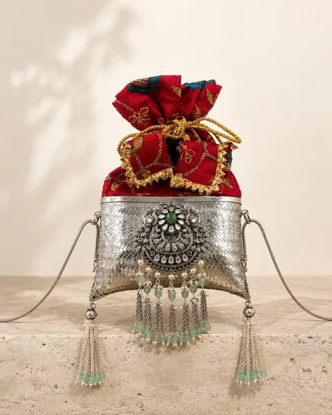 Sterling silver potli purse with scarlet silk and enamel tassels, handcrafted in Jaipur.