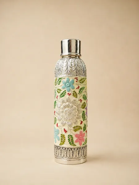 Sterling silver water bottle in pastel spring-flower meenakari on cream, handcrafted in Jaipur.